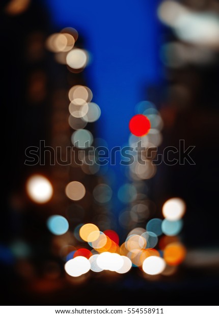 Abstract blurred city\
background. Large city street lights at night. Lights and shadows\
of New York City