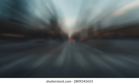 An abstract blurred cityscape with dramatic light rays emanating from the center, creating a sense of movement and energy.