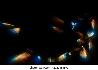 Abstract blurred colorful lens flare bokeh on black