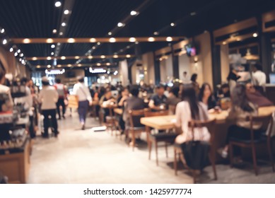 Abstract Blurred Of Crowd People Interior Coffee Shop Or Cafe Restaurant With Light Bokeh For  Background