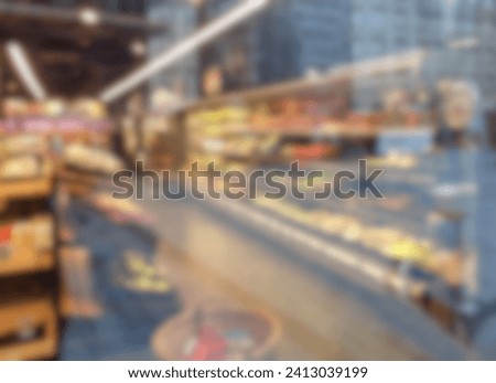 Abstract blurred and defocused storefront glass window of the supermarket, shop or store background with a reflection of modern buildings