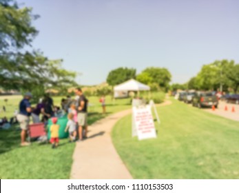 Abstract Blurred Diverse Group Of People Checking In At Fishing Community Event. Free Summer Activities Sponsored By Neighborhood Association In Irving, Texas, USA