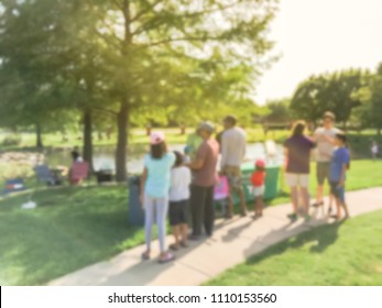 Abstract Blurred Diverse Group Of People Checking In At Fishing Community Event. Free Summer Activities Sponsored By Neighborhood Association In Irving, Texas, USA