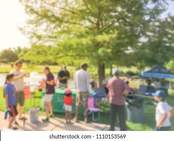 Abstract Blurred Diverse Group Of People Checking In At Fishing Community Event. Free Summer Activities Sponsored By Neighborhood Association In Irving, Texas, USA