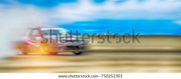 Abstract blurred drift cars with smoke from burned\
tire on speed drift\
track