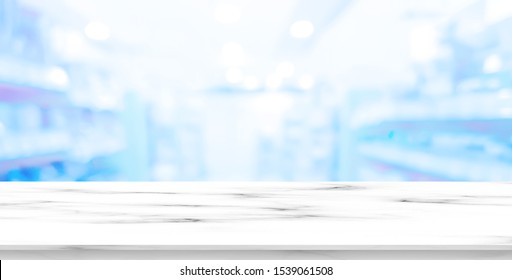 Abstract Blurred Drug Store Aisle Shelf Distribution Background With White Marble Perspective Counter To Show,promote,advertise On Display For Medical Pharmaceutical Business Concept