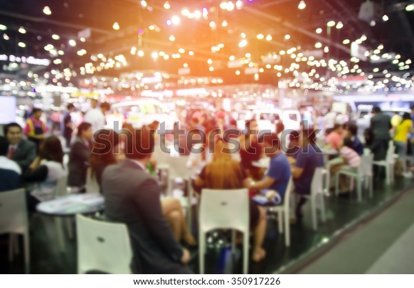abstract blurred\
event with people for\
background