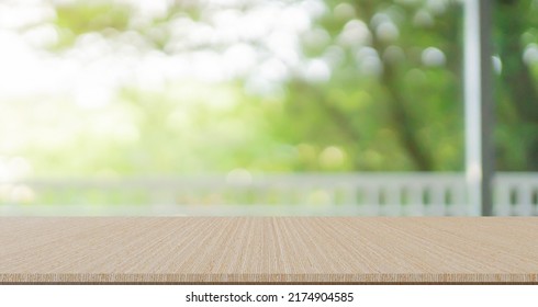 abstract blurred garden view form living room window with concrete table counter background for show , promote ,design banner ads on display concept - Shutterstock ID 2174904585