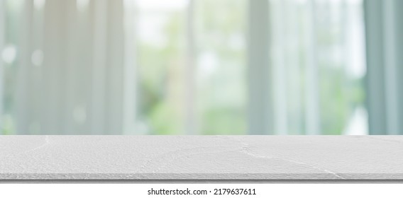 abstract blurred garden view form living room window with concrete table counter background for show , promote ,design banner ads on display concept - Shutterstock ID 2179637611