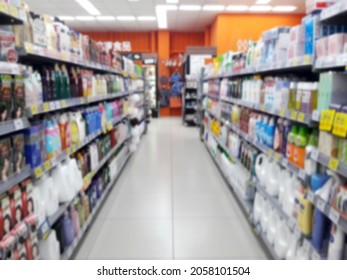 Abstract Blurred Grocery Store Interior Background. Blur Aisle Of Supermarket, Grocery Store Or Warehouse For Backdrop And Design Element Use. Defocused Background With Bokeh Light.