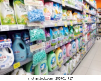 Abstract Blurred Grocery Store Interior Background. Blur Aisle Of Supermarket, Grocery Store Or Warehouse For Backdrop And Design Element Use. Defocused Background With Bokeh Light.