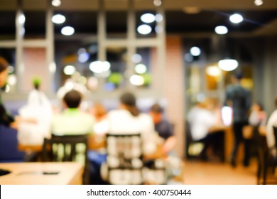 Abstract Blurred Group Of Asian Family Meeting Dinner In The Restaurant Background.