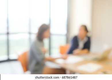 Abstract Blurred Group Of Two Business Woman Talking,discussion About Her Work In Office Meeting Room,blurry People Background Concept