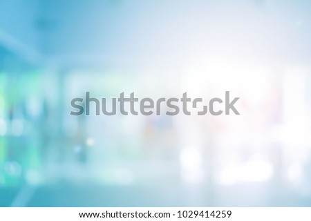 abstract blurred of hospital corridor blue color background concept.