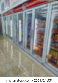 Abstract Blurred Image Aisle With Various Kinds Display Of Drinks On The Fridge Shelves Inside Retail Store Or Minimarket