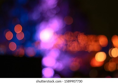 Abstract Blurred Image Of Carnival Amusement Part Background.