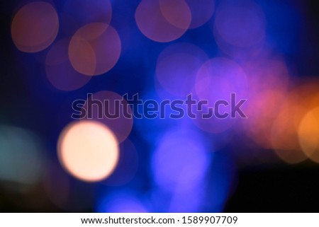 Abstract blurred image of Carnival amusement part background.