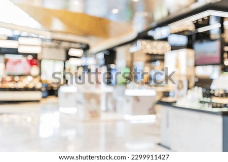 Abstract blurred image of cosmetics department store in the mall
