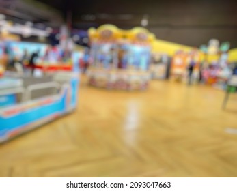 Abstract Blurred Image  Inside Of Indoor Game Zone With Arcade Machine On The Background. 
