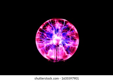 Abstract, blurred image of lightning in a plasma ball. Dark background.
