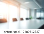 Abstract blurred image of modern office with soft light for background usage. Blur office workplace interior background desing concept.