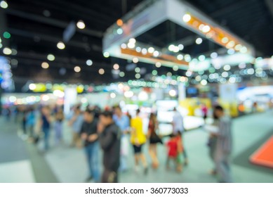 Abstract blurred image of people in cars exhibition show - Shutterstock ID 360773033