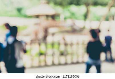 Abstract Blurred Image Of  People Looking To Giraffe At  Safari Zoo With Bokeh For Background Usage . (vintage Tone)