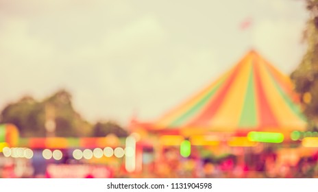 Abstract Blurred Image Of Theme Park On Day Time With Bokeh For Background Usage . (vintage Tone)