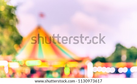 Abstract Blurred image of Theme park on day time with bokeh for background usage . (vintage tone)