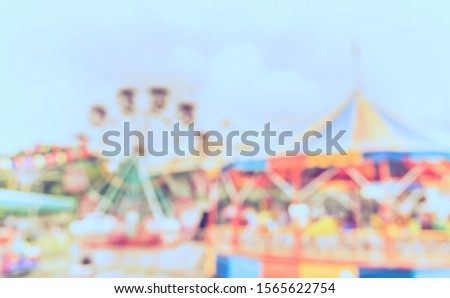 Abstract Blurred image of Theme park on day time with bokeh for background usage . (vintage tone)