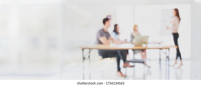 Abstract blurred interior modern office space with business people group working banner background with copy space.