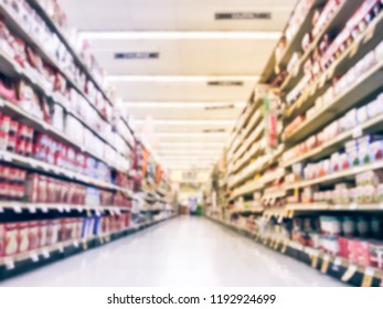 Abstract Blurred Low Angle View Bake Time, Spices, Cake Mixes, Cooking Oil, Gelatin, Cooking Gadgets, Food Storage Aisle At Grocery Store In Irving, Texas, US. Supermarket Shelves Variety Of Products