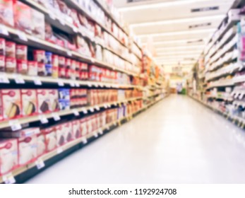 Abstract Blurred Low Angle View Bake Time, Spices, Cake Mixes, Cooking Oil, Gelatin, Cooking Gadgets, Food Storage Aisle At Grocery Store In Irving, Texas, US. Supermarket Shelves Variety Of Products