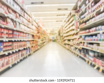 Abstract Blurred Low Angle View Bake Time, Spices, Cake Mixes, Cooking Oil, Gelatin, Cooking Gadgets, Food Storage Aisle At Grocery Store In Irving, Texas, US. Supermarket Shelves Variety Of Products