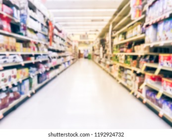 Abstract Blurred Low Angle View Bake Time, Spices, Cake Mixes, Cooking Oil, Gelatin, Cooking Gadgets, Food Storage Aisle At Grocery Store In Irving, Texas, US. Supermarket Shelves Variety Of Products