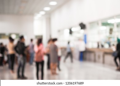 Abstract Blurred Medical Background Clinic Service Counter Lobby With Patient Paying Bill At Cashier Desk.