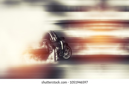 Abstract blurred old car drifting, Sport car wheel drifting and smoking on blurred background. Motorsport concept.