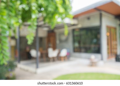 Abstract blurred outdoor coffee shop in garden on day time background