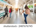 Abstract blurred of passengers walking on walkway at railway station use for the background. Blurred people waiting for subway at station, transportation background. background of people in subway