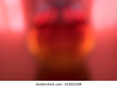 Abstract blurred pattern with an oval mid-flame on a red background