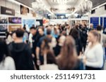 Abstract blurred people at exhibition hall of expo event trade show. Business convention show or job fair. Business concept background.