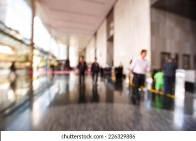 Abstract Blurred People Walking Or Standing In Office Building