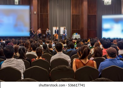 Abstract blurred photo of conference hall or seminar room with attendee background