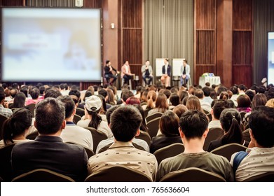 Abstract Blurred Photo Of Conference Hall Or Seminar Room With Attendee Background