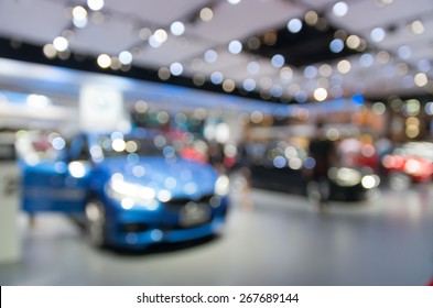 Abstract blurred photo of motor show, car show room