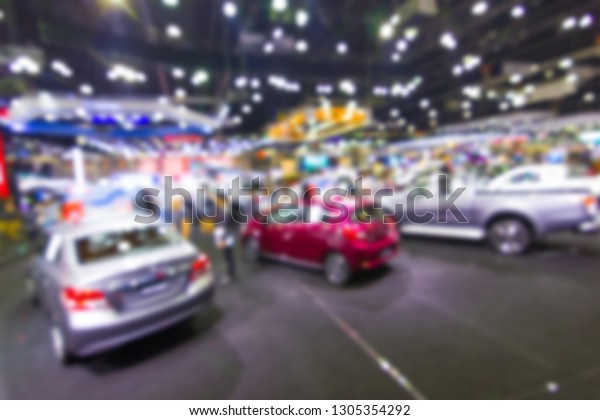 Abstract Blurred, at public event\
exhibition hall showing cars and new model, new\
innovation