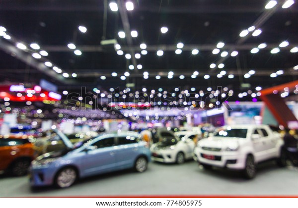 Abstract Blurred, at public event\
exhibition hall showing cars and new model, new\
innovation