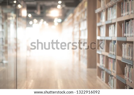 Abstract blurred public library interior space. blurry room with bookshelves by defocused effect. use for background or backdrop in business or education concepts