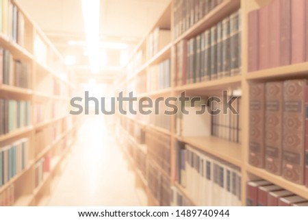 Abstract blurred public library interior space. blurry room with bookshelves by defocused effect. use for background or backdrop in business or education concepts