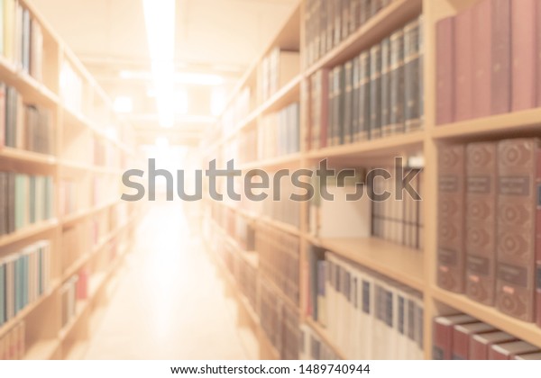 Abstract blurred public library\
interior space. blurry room with bookshelves by defocused effect.\
use for background or backdrop in business or education\
concepts